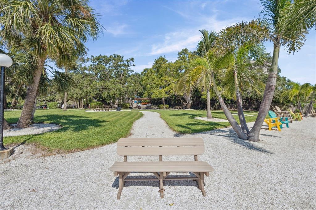 6415 Midnight Pass Road, Unit 211 Sarasota, FL 34242 - Photo 52 of 58 a view of a park with slide