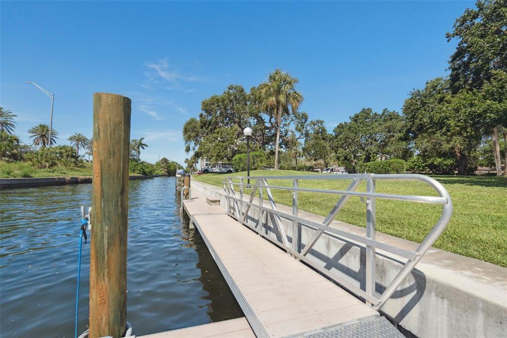 6415 Midnight Pass Road, Unit 211 Sarasota, FL 34242 - Photo 53 of 58 a view of a chairs and table on the wooden floor
