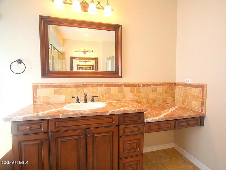 276 Chantilly Circle Simi Valley, CA 93065 - Photo 18 of 25 a bathroom with a sink and a mirror