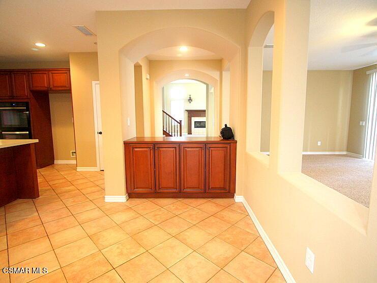 276 Chantilly Circle Simi Valley, CA 93065 - Photo 9 of 25 a view of a hallway with wooden floor and a living room