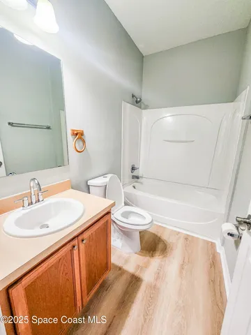 a bathroom with a sink a toilet and a bathtub