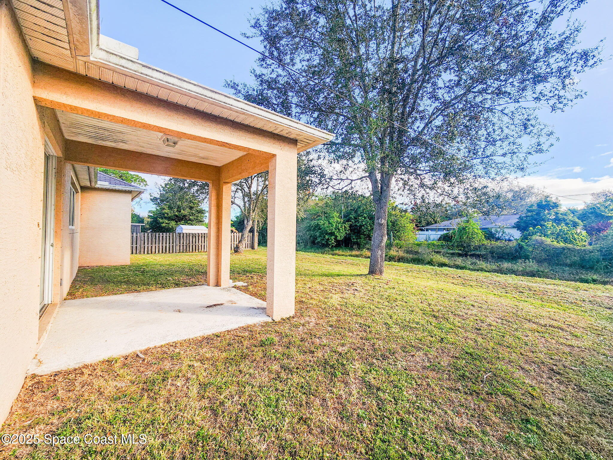 1421 Halstead Avenue Northwest Palm Bay, FL 32907 - Photo 3 of 22 a view of a house with backyard and porch