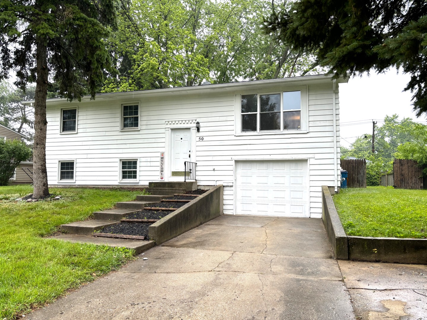 50 Marnel Road Montgomery, IL 60538 - Photo 1 of 12 a view of a back yard of the house