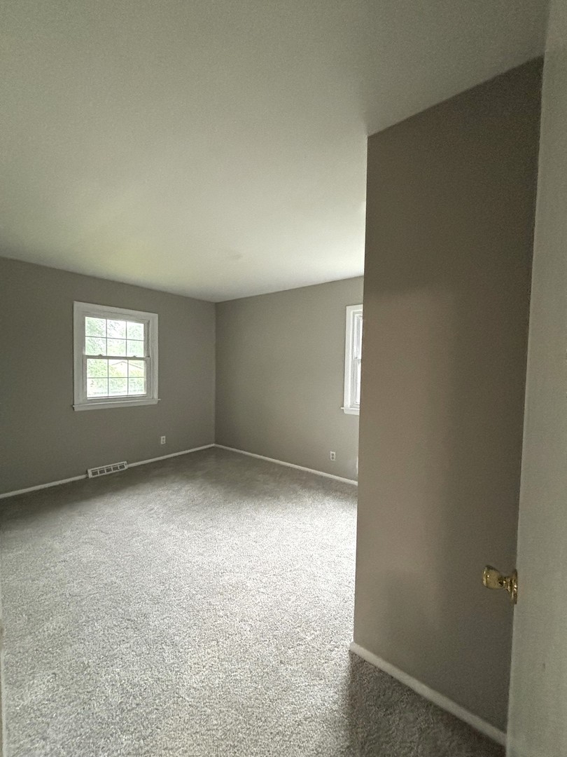 50 Marnel Road Montgomery, IL 60538 - Photo 5 of 12 an empty room with windows