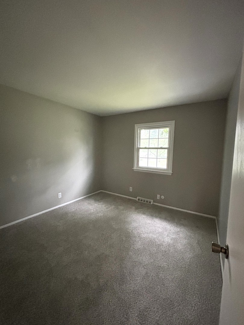 50 Marnel Road Montgomery, IL 60538 - Photo 7 of 12 an empty room with a window