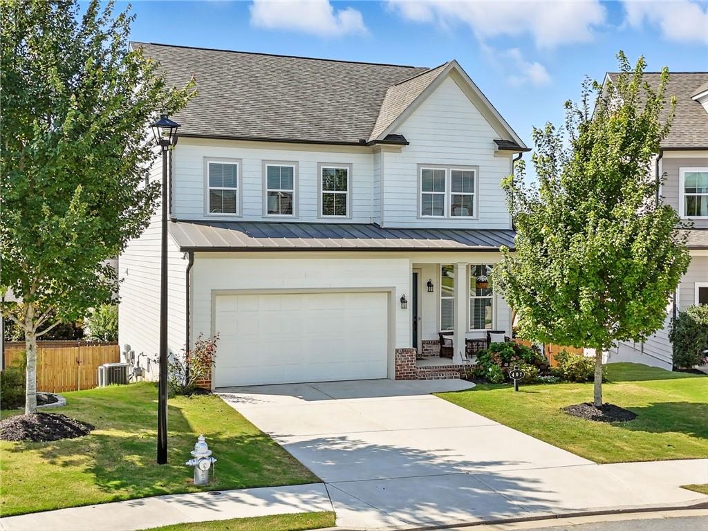 a front view of a house with garden
