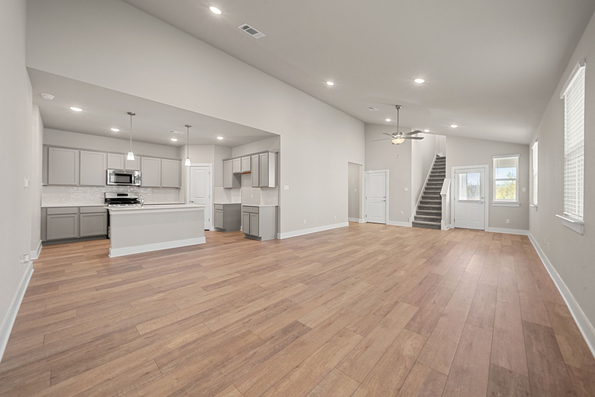 219 Pinnacle Lane Kyle, TX 78640 - Photo 15 of 20 a view of kitchen with wooden floor