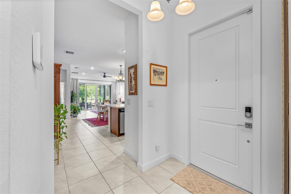 19707 Weathervane Way Loxahatchee, FL 33470 - Photo 12 of 51 a view of a hallway with dining area