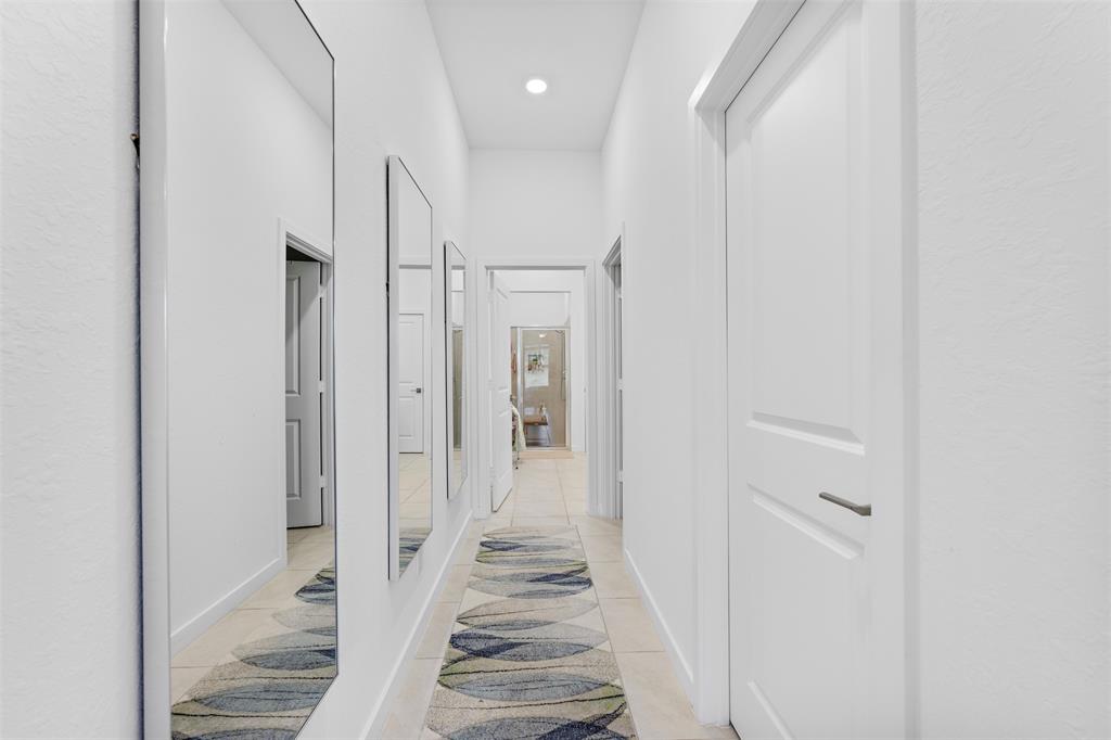 19707 Weathervane Way Loxahatchee, FL 33470 - Photo 14 of 51 a view of a hallway with white walls and entryway