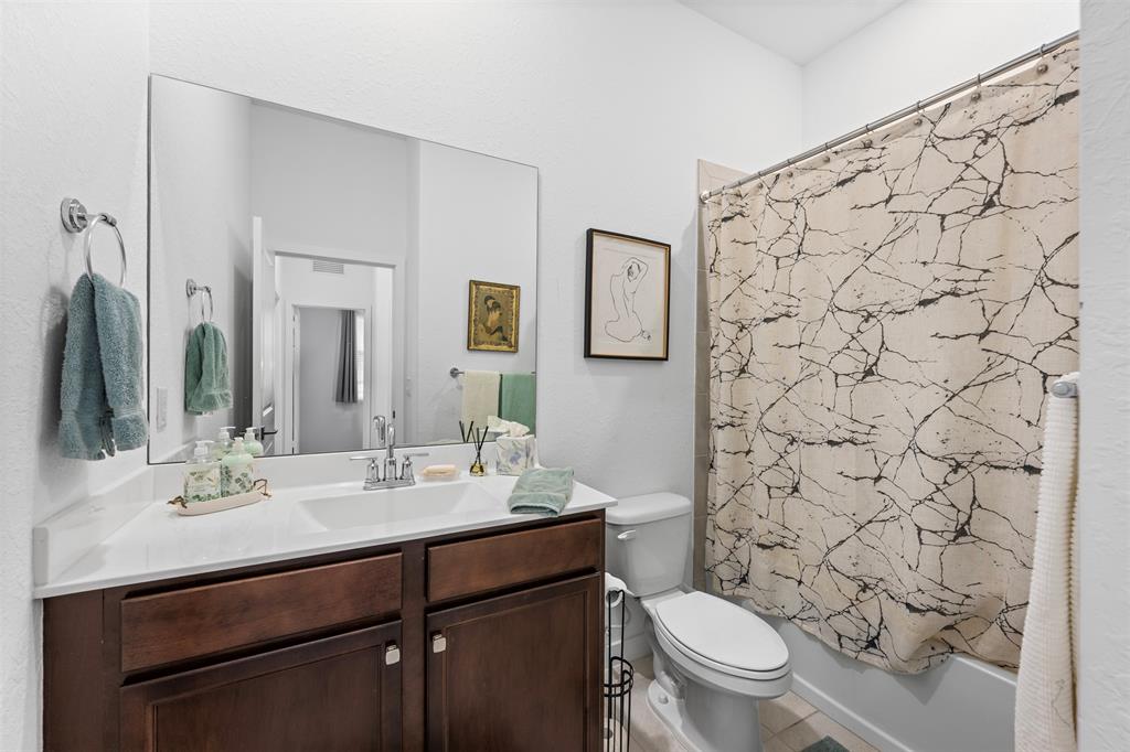 19707 Weathervane Way Loxahatchee, FL 33470 - Photo 10 of 51 a bathroom with a sink toilet and shower