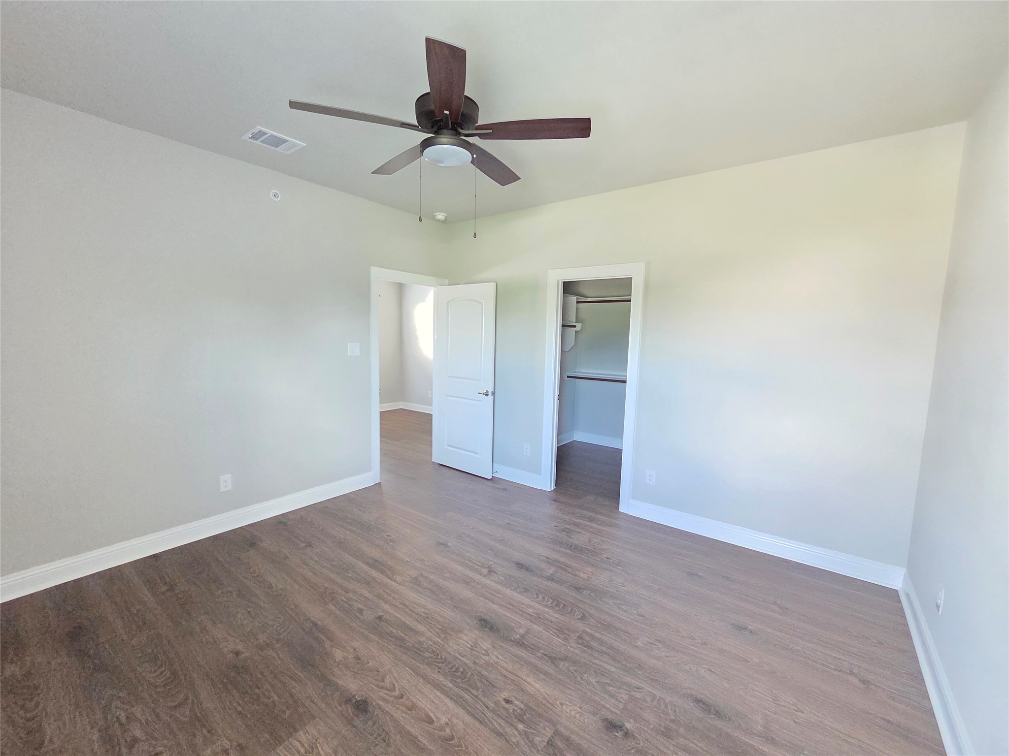 600 C-Bar Ranch Trail, Unit 121 Cedar Park, TX 78613 - Photo 22 of 32 Ample floor space and well-appointed closet access define this inviting bedroom.
