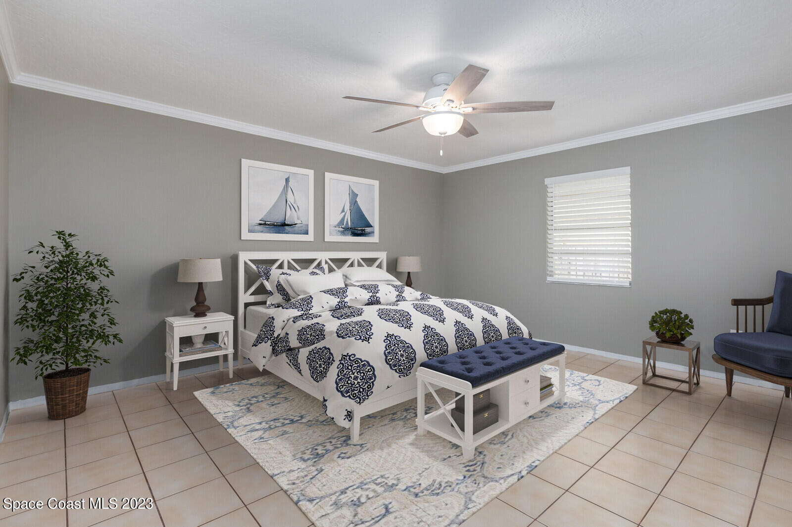 3229 Marshall Drive Melbourne, FL 32901 - Photo 17 of 36 a bedroom with a bed and a chandelier