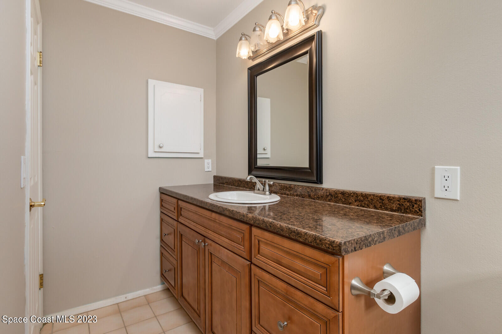 3229 Marshall Drive Melbourne, FL 32901 - Photo 23 of 36 a bathroom with a granite countertop sink and a mirror
