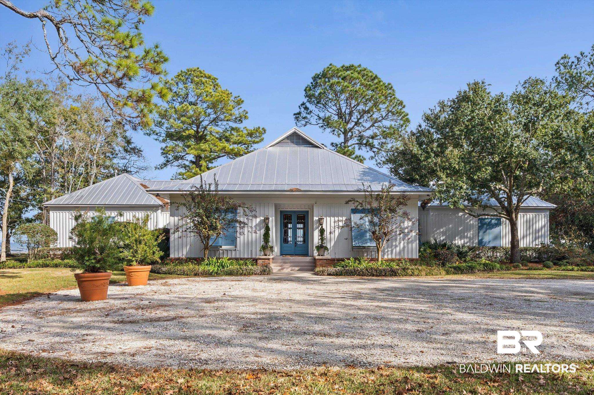 7015 Bay Road Mobile, AL 36605 - Photo 1 of 53 View of front of house featuring a metal roof