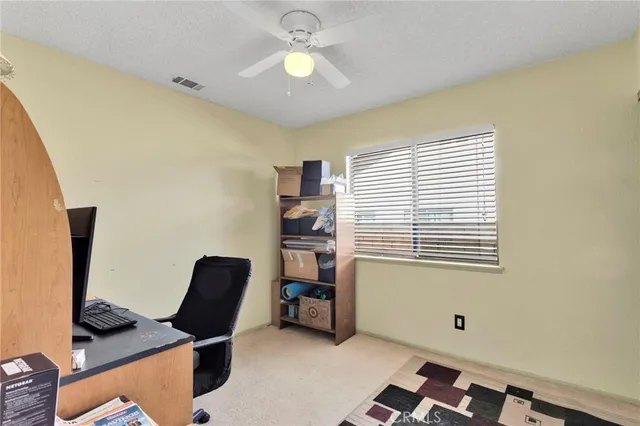 a workspace with furniture and a window