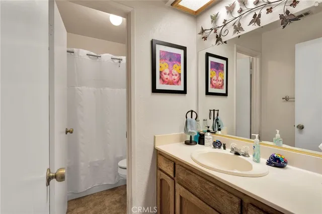 a bathroom with 2 sink and a mirror