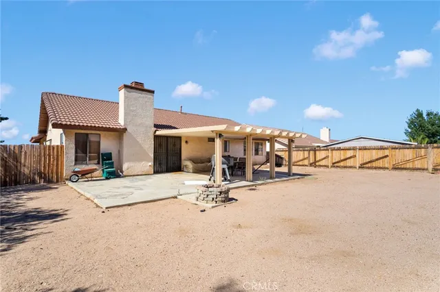 a view of a building with snow on the road