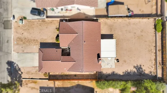 an aerial view of a house with a ocean view