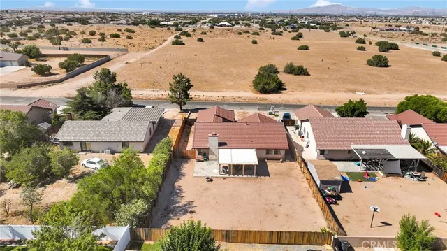 an aerial view of a house with outdoor space