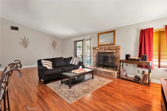 a living room with furniture fireplace and flat screen tv