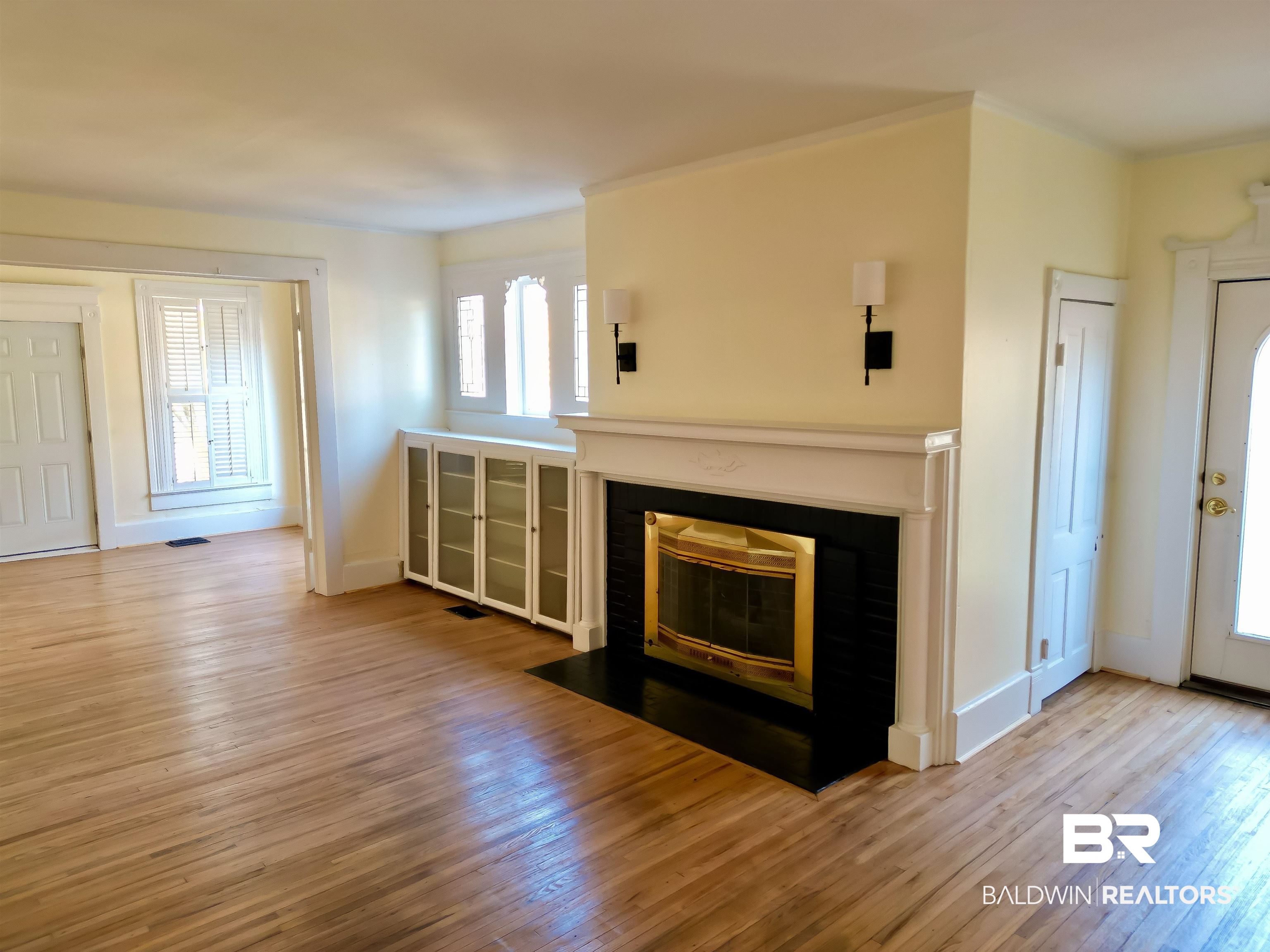 73 Liberty Street Monroeville, AL 36460 - Photo 9 of 29 Unfurnished living room featuring light wood-type flooring