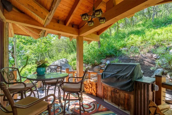 a view of balcony with furniture and garden