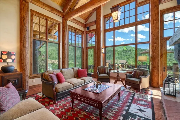 a living room with furniture a rug and a fireplace