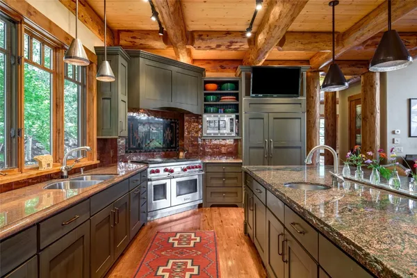 a kitchen with a stove and a sink