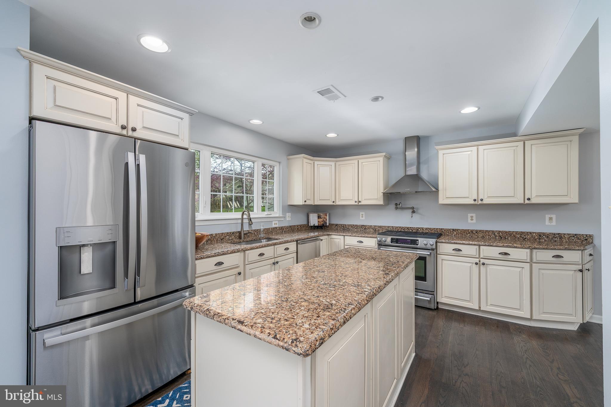 1346 Becket Road Eldersburg, MD 21784 - Photo 12 of 73 a kitchen with stainless steel appliances granite countertop a sink stove and refrigerator