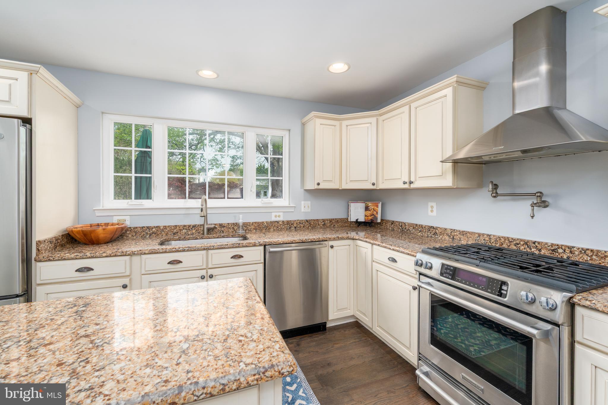 1346 Becket Road Eldersburg, MD 21784 - Photo 13 of 73 a kitchen with stainless steel appliances granite countertop a stove a sink and a white cabinets