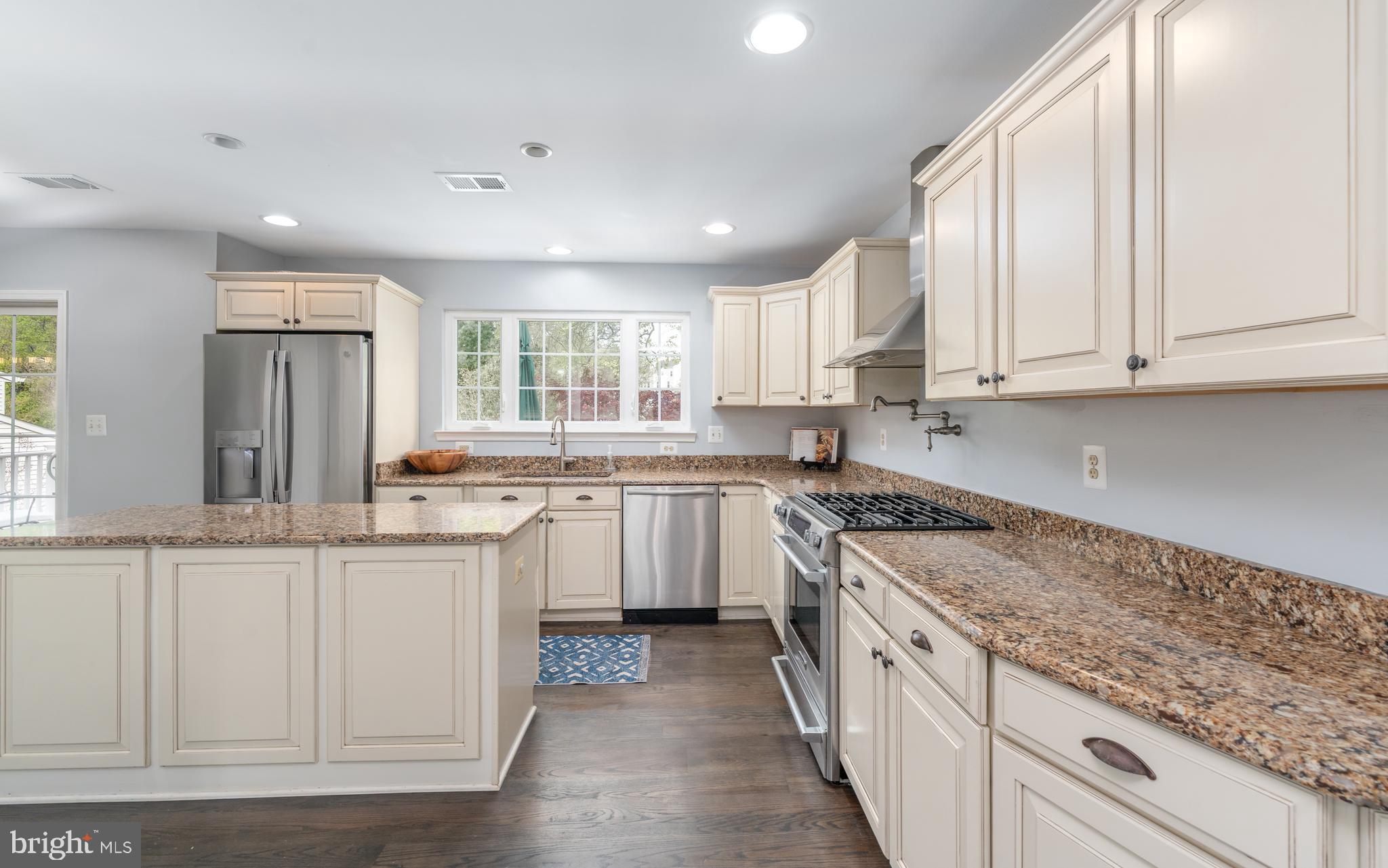 1346 Becket Road Eldersburg, MD 21784 - Photo 14 of 73 a kitchen with granite countertop white cabinets and white appliances