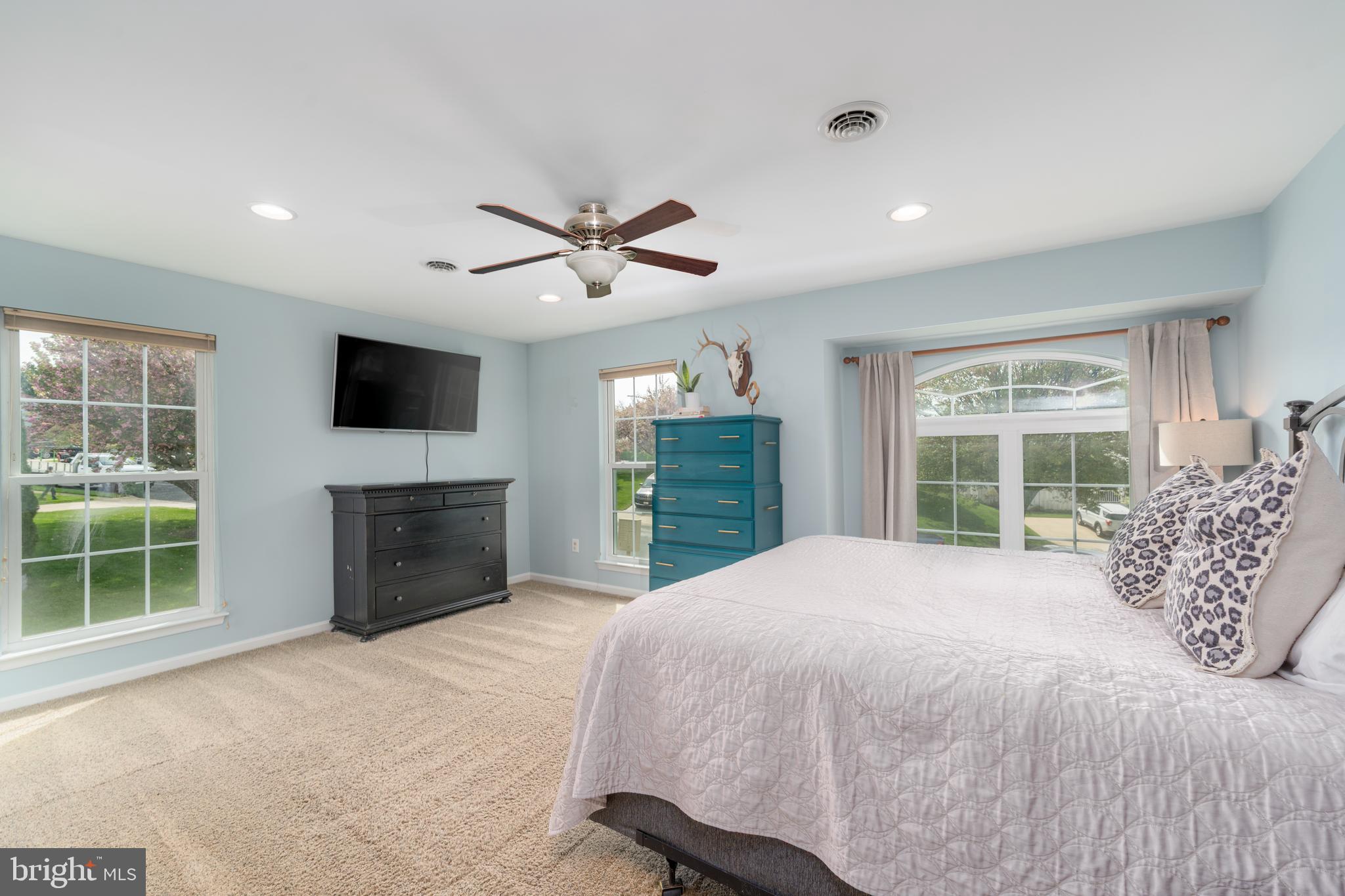 1346 Becket Road Eldersburg, MD 21784 - Photo 21 of 73 a bedroom with a large bed and a flat screen tv