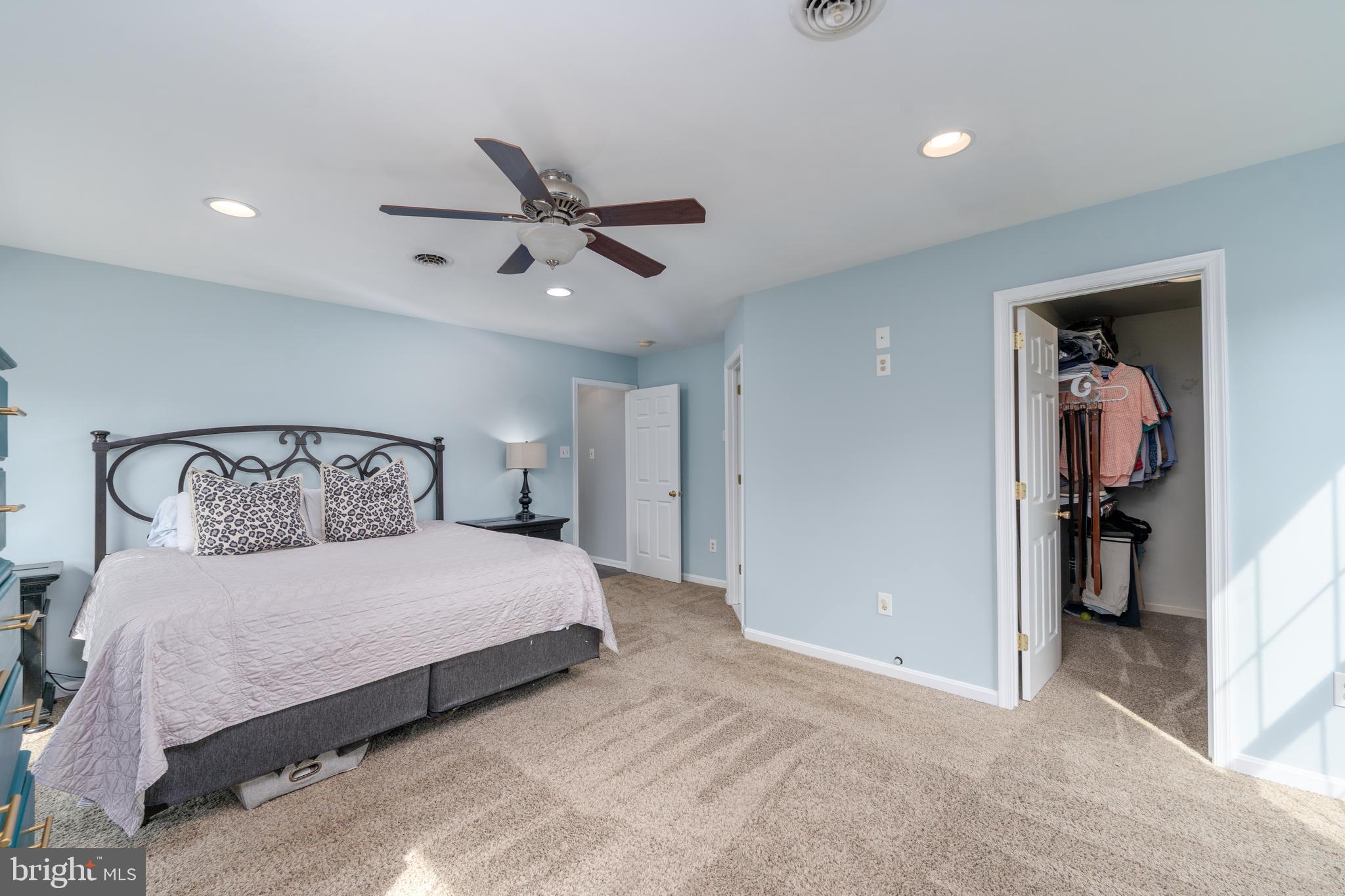 1346 Becket Road Eldersburg, MD 21784 - Photo 22 of 73 a bedroom with a large bed and a ceiling fan
