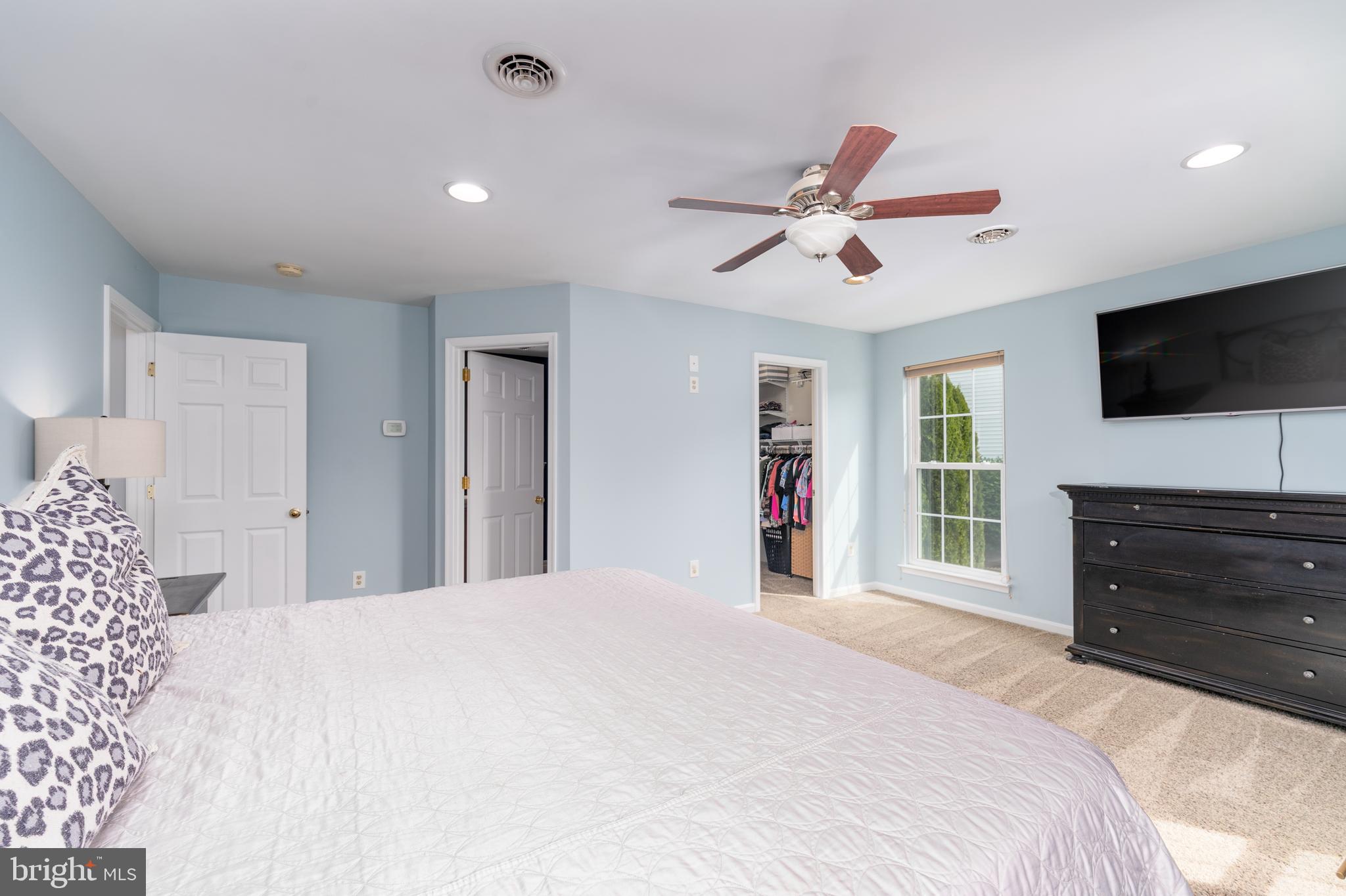 1346 Becket Road Eldersburg, MD 21784 - Photo 24 of 73 a bedroom with a bed and a flat screen tv