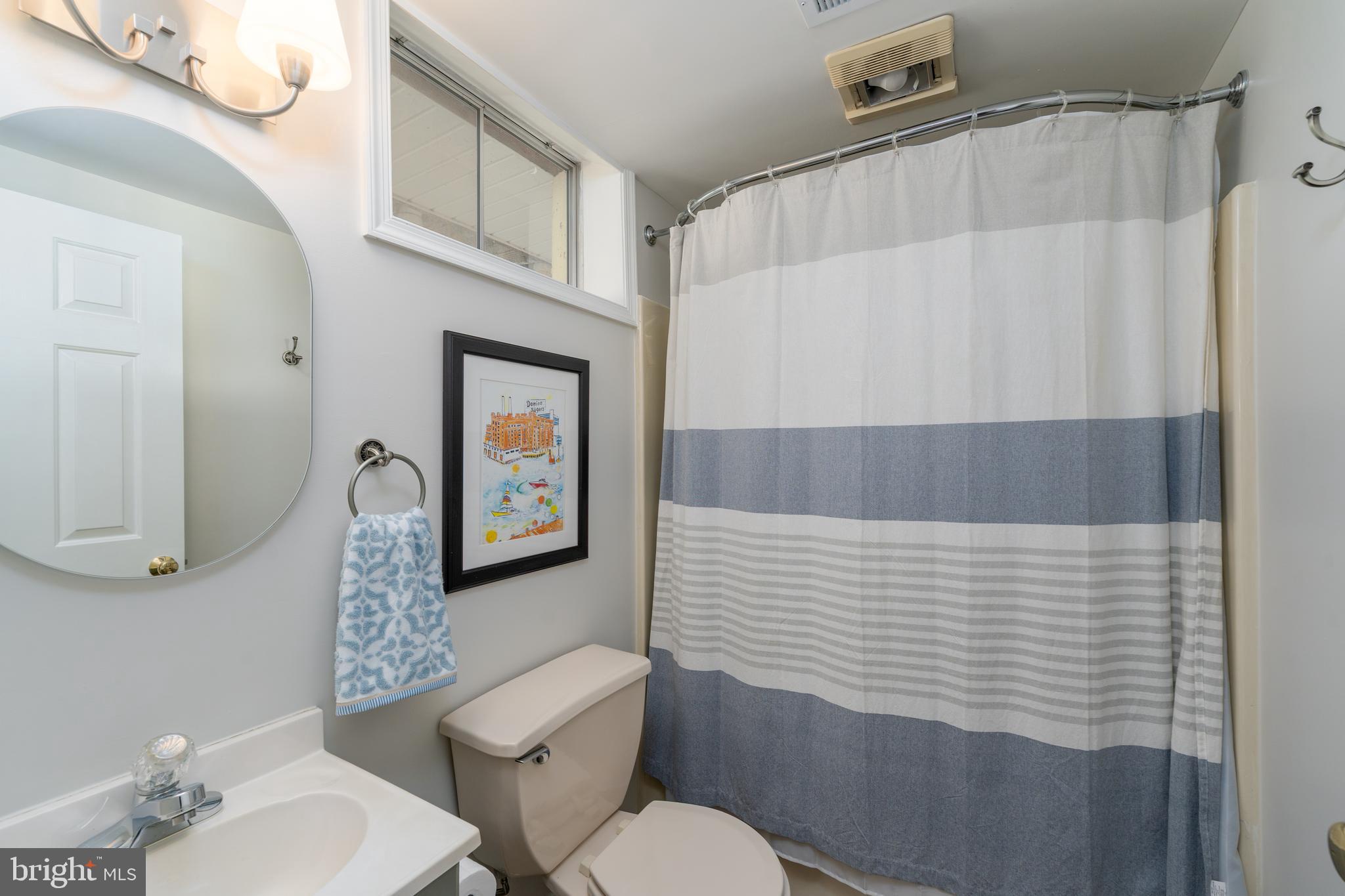 1346 Becket Road Eldersburg, MD 21784 - Photo 35 of 73 a bathroom with a toilet a sink and mirror
