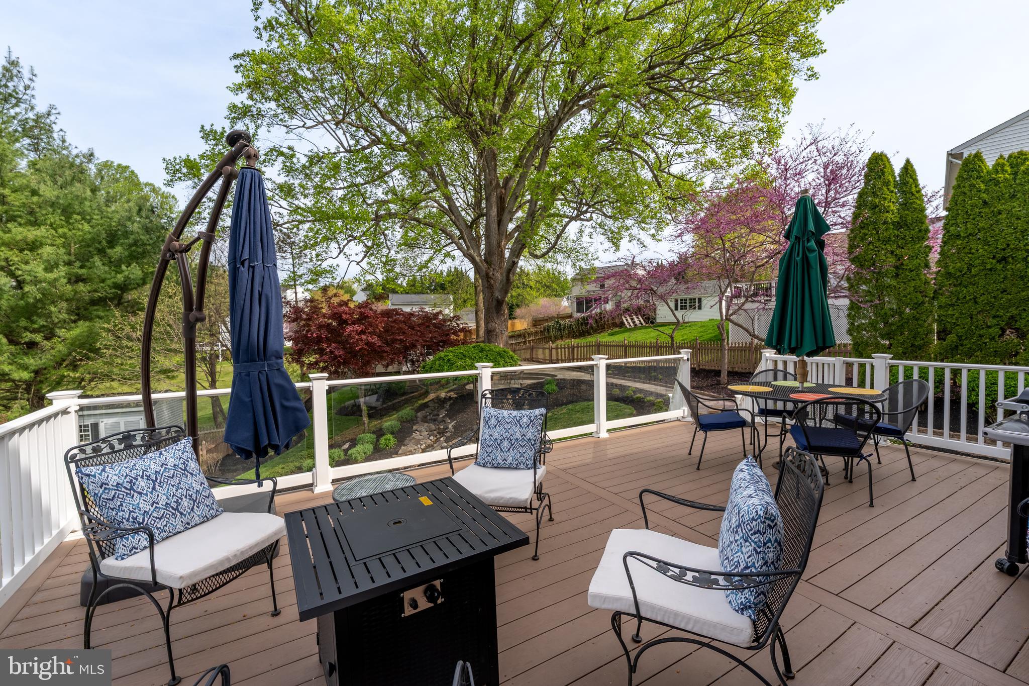 1346 Becket Road Eldersburg, MD 21784 - Photo 37 of 73 a view of a patio with a dining table and chairs with wooden floor and fence