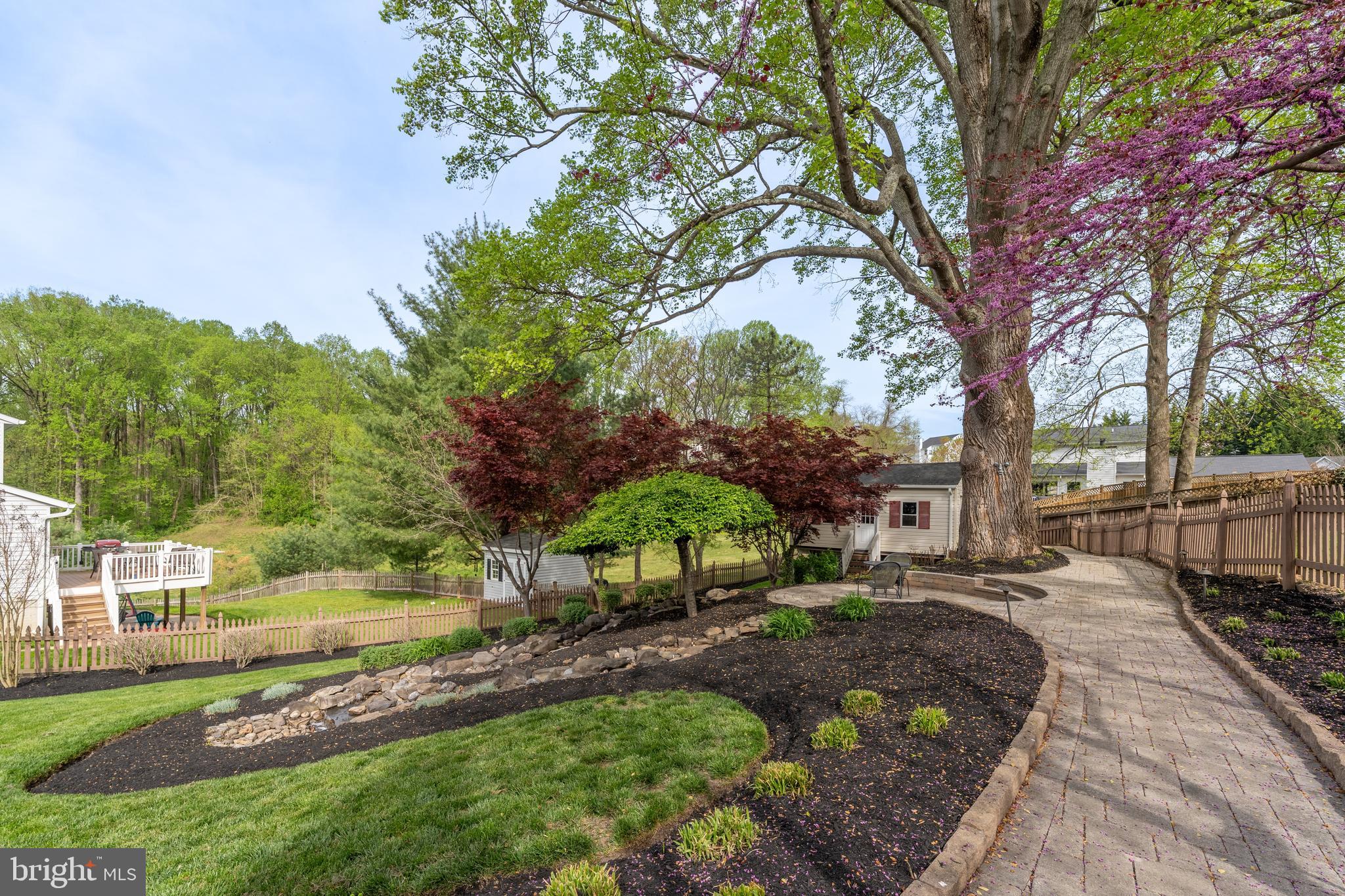 1346 Becket Road Eldersburg, MD 21784 - Photo 41 of 73 a view of a yard with plants and trees