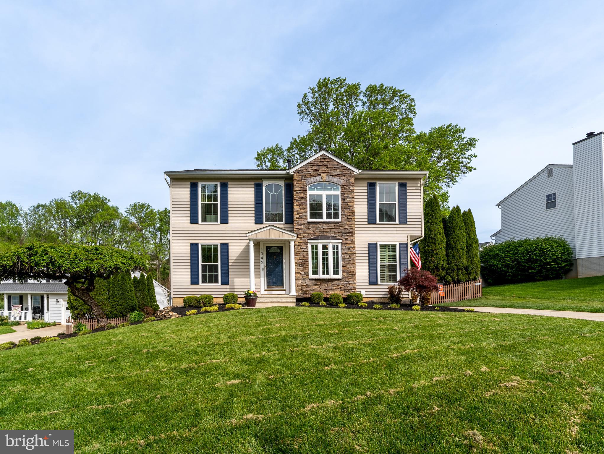 1346 Becket Road Eldersburg, MD 21784 - Photo 48 of 73 a front view of a house with garden and trees