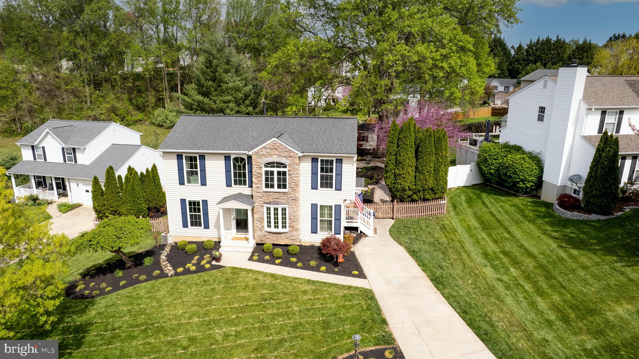 1346 Becket Road Eldersburg, MD 21784 - Photo 49 of 73 aerial view of a house with a yard table and chairs under an umbrella