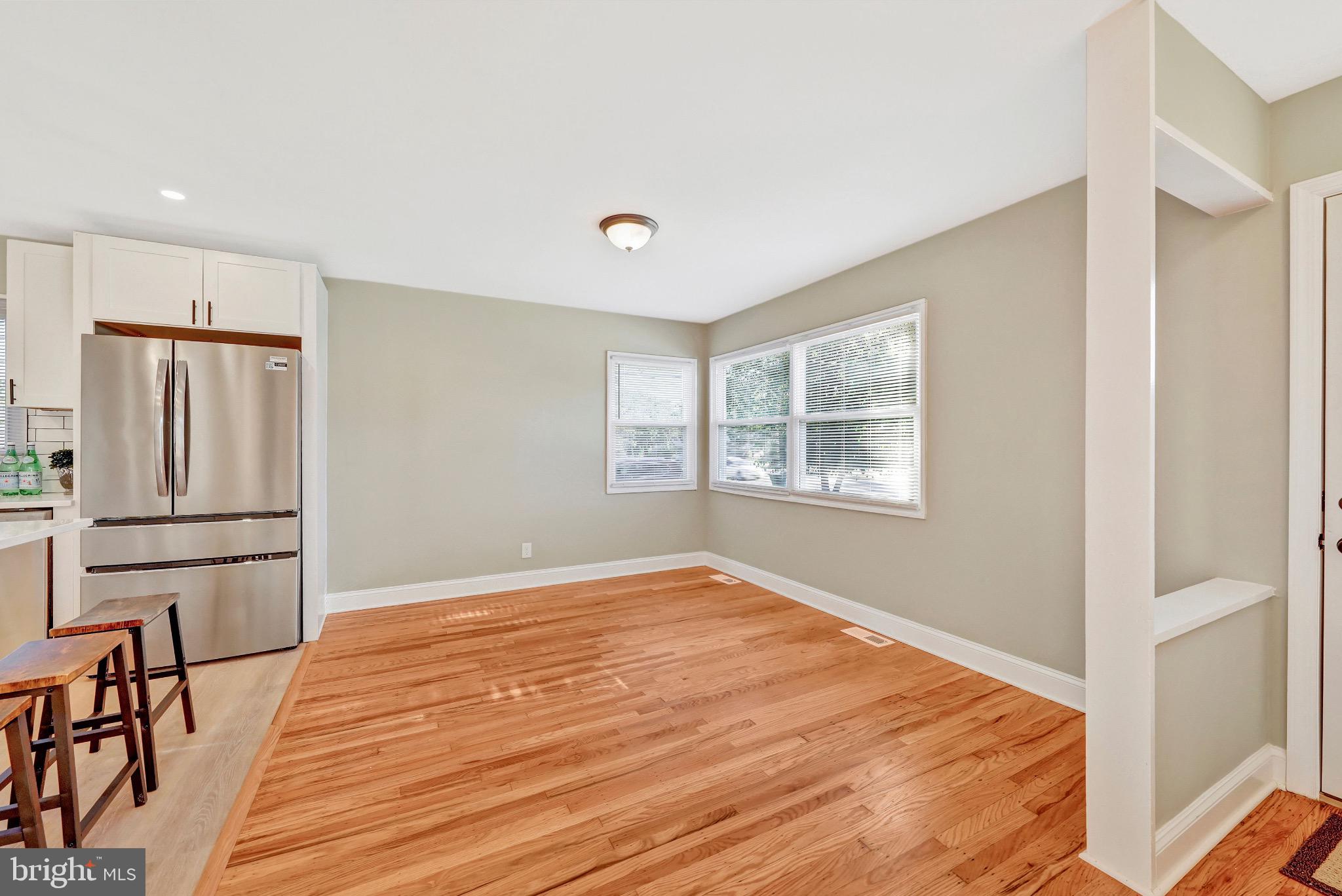 1538 Haddonfield-Berlin Road Cherry Hill, NJ 08003 - Photo 14 of 36 a view of empty room with wooden floor and window