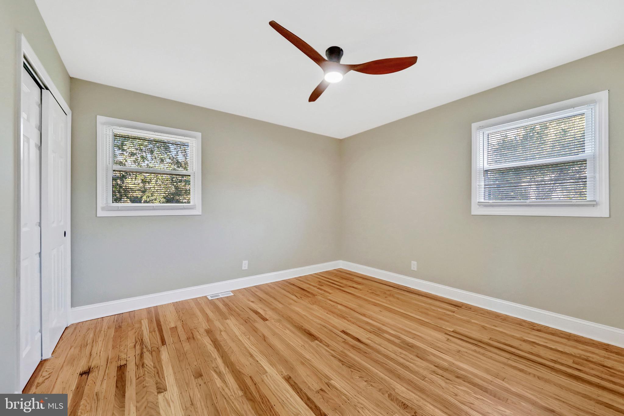 1538 Haddonfield-Berlin Road Cherry Hill, NJ 08003 - Photo 22 of 36 a view of room with wooden floor and a ceiling fan