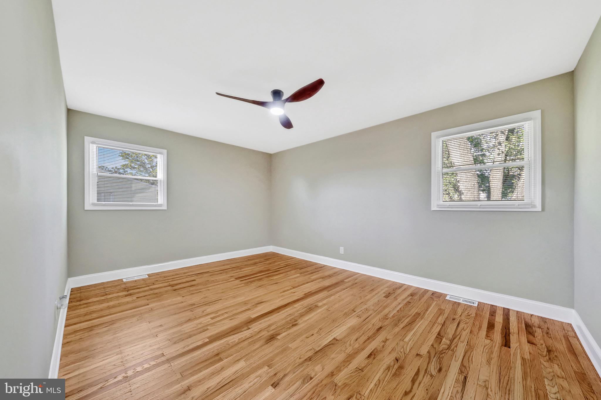 1538 Haddonfield-Berlin Road Cherry Hill, NJ 08003 - Photo 24 of 36 a view of a room with wooden floor and ceiling fan
