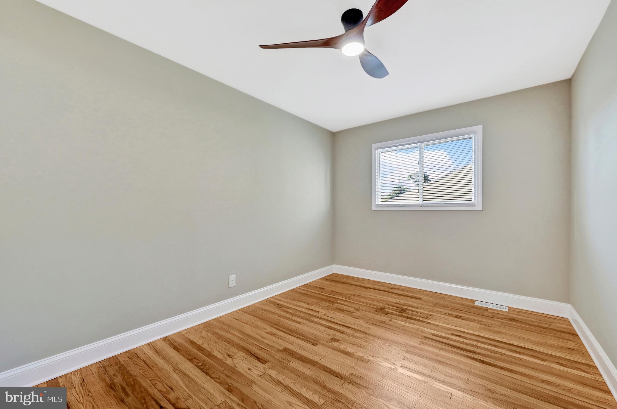 1538 Haddonfield-Berlin Road Cherry Hill, NJ 08003 - Photo 26 of 36 a view of empty room with wooden floor