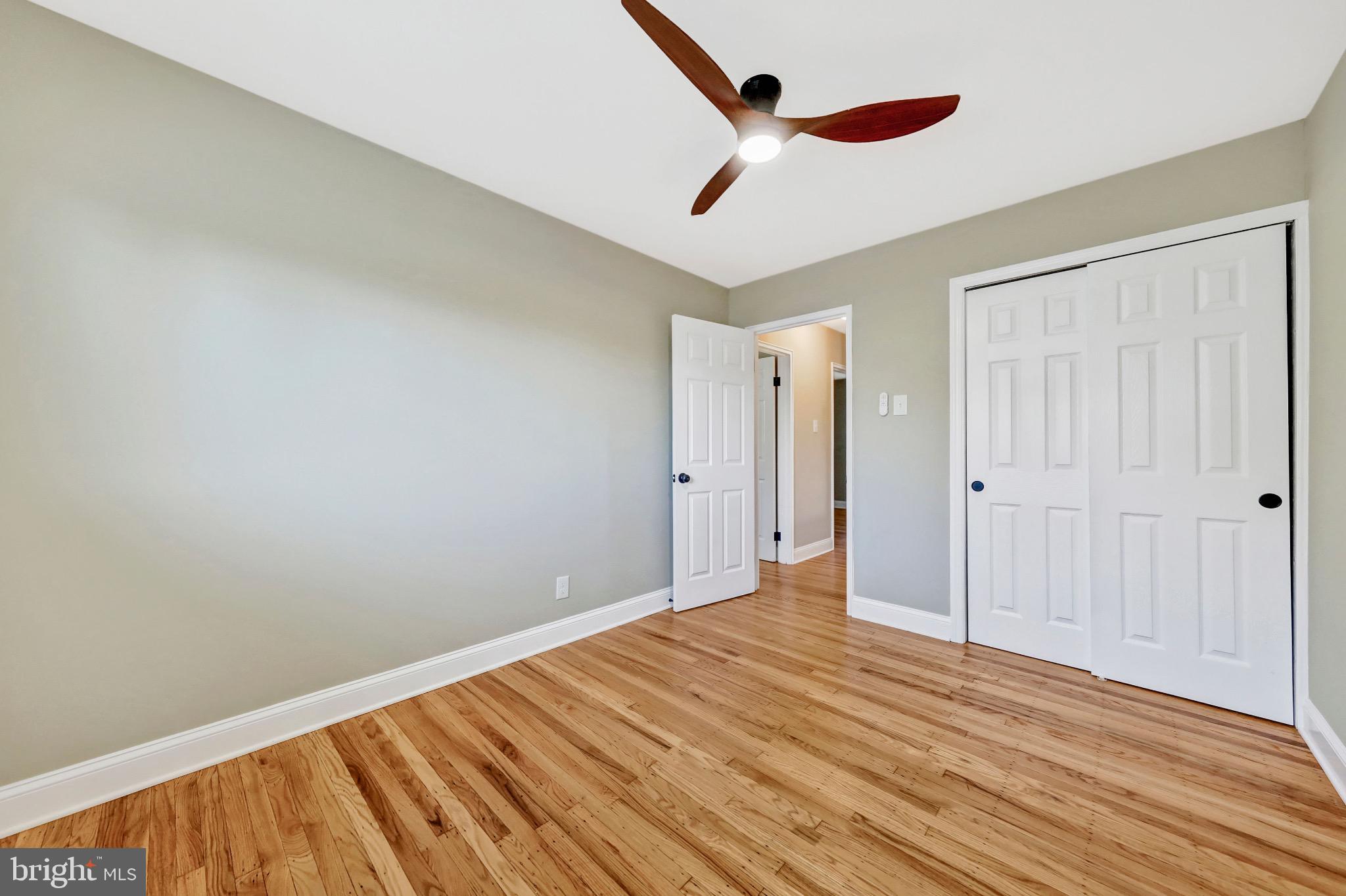 1538 Haddonfield-Berlin Road Cherry Hill, NJ 08003 - Photo 27 of 36 a view of a room with wooden floor and white walls