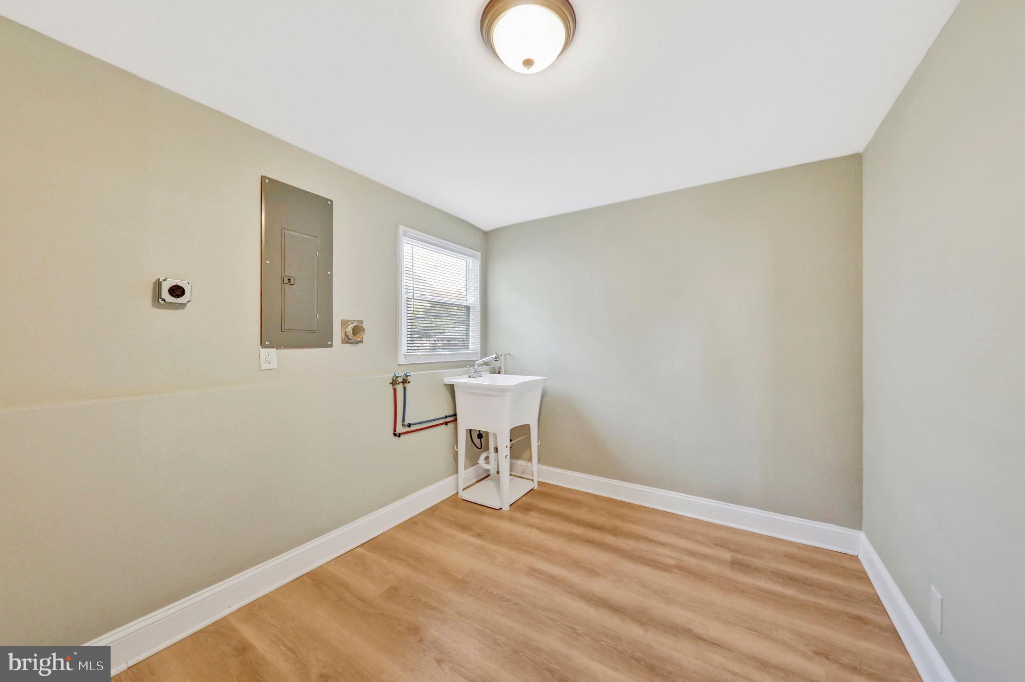 1538 Haddonfield-Berlin Road Cherry Hill, NJ 08003 - Photo 10 of 36 a view of a livingroom with wooden floor and a window