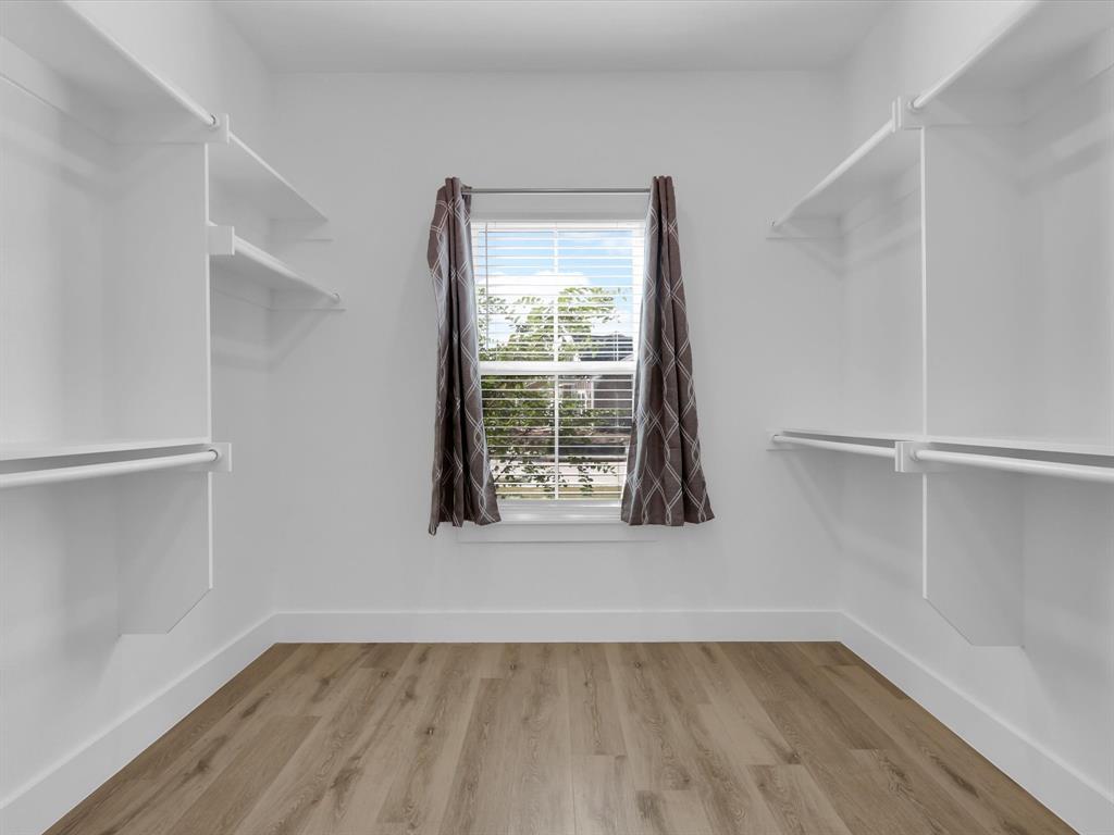 4905 Sweetbay Road Sherman, TX 75092 - Photo 20 of 26 a view of an empty room with wooden floor and a window