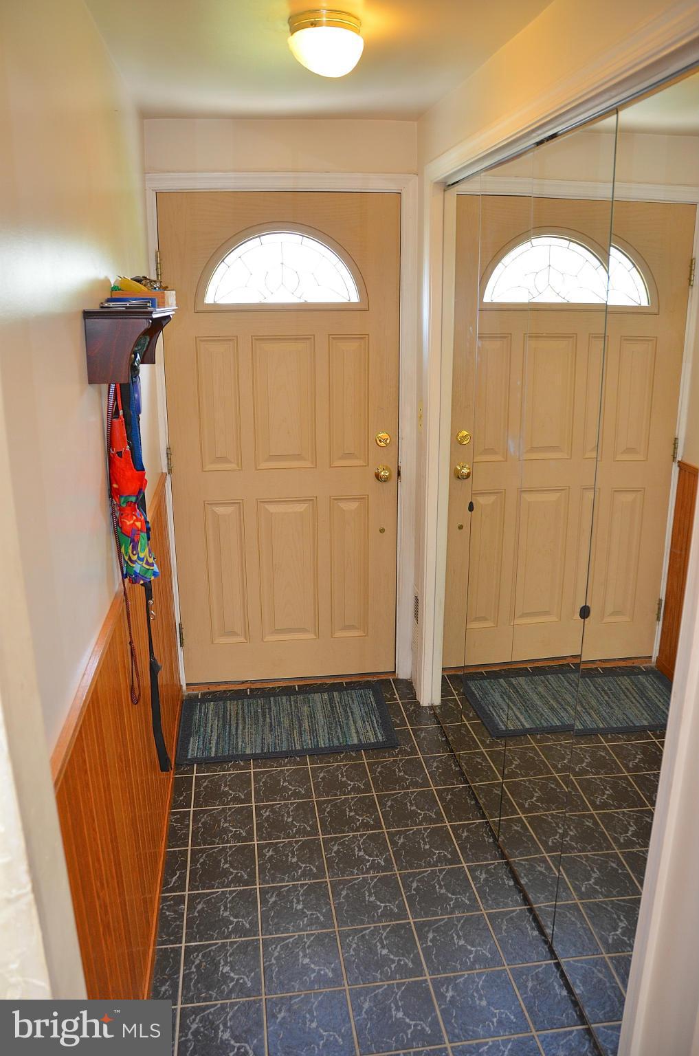 1607 Grange Road Edgewater, MD 21037 - Photo 3 of 30 a view of a hallway with wooden walls