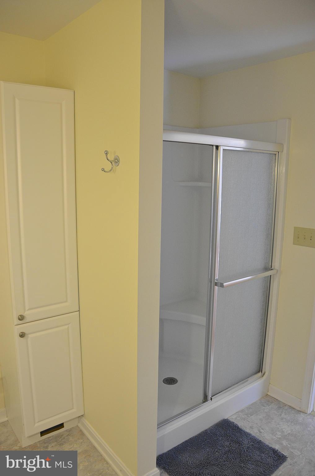 1607 Grange Road Edgewater, MD 21037 - Photo 21 of 30 a bathroom with a glass shower door