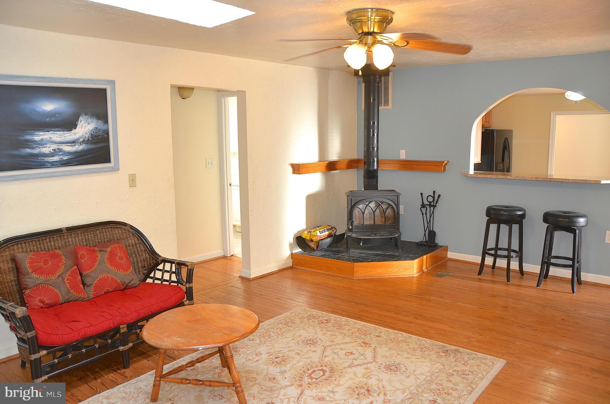 1607 Grange Road Edgewater, MD 21037 - Photo 4 of 30 a living room with furniture and a flat screen tv