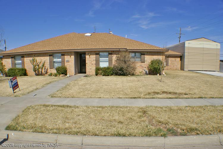 4202 Rondo Avenue Amarillo, TX 79110 - Photo 1 of 14 a front view of a house with a yard